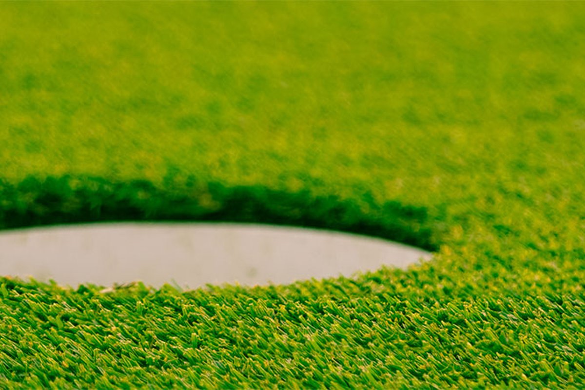 Close-up of a golf hole on the lush green putting surface at King Rail Reserve GC in Lynnfield, MA